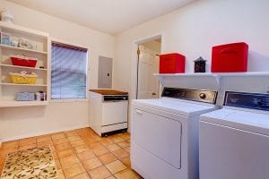 Laundry Room With Window And Ceramic Tile Floor.